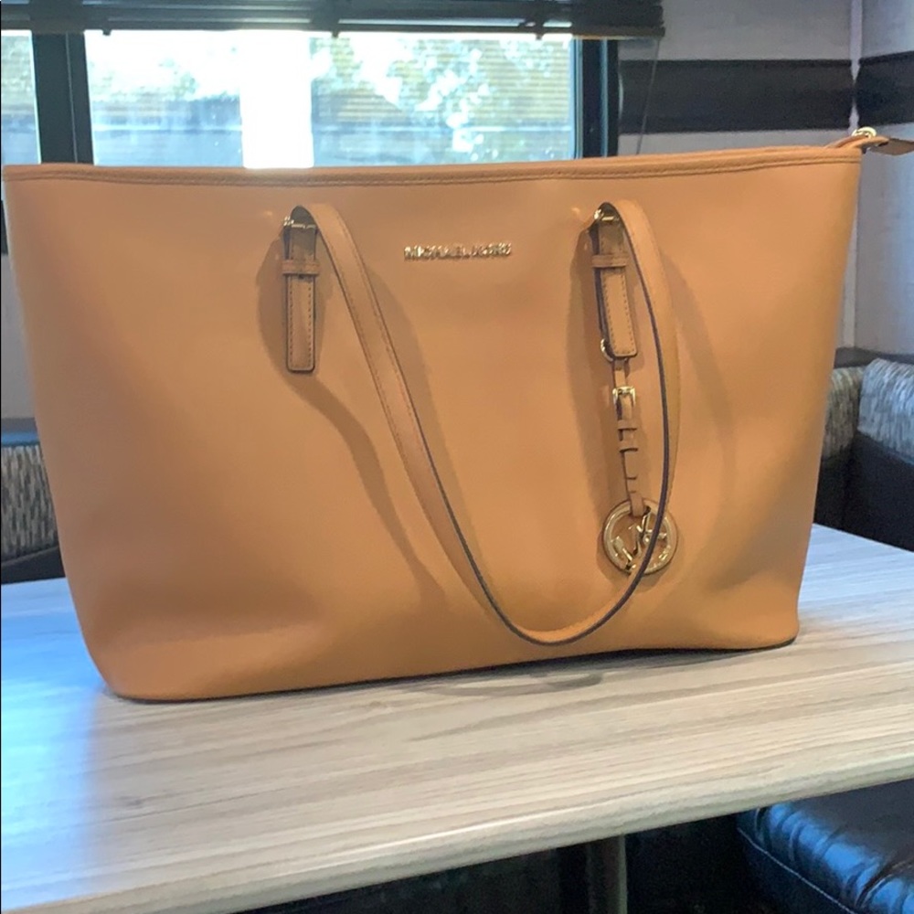 Authentic Michael Kors brown leather zip tote